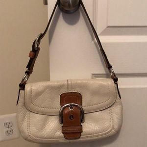 White and brown Coach shoulder bag